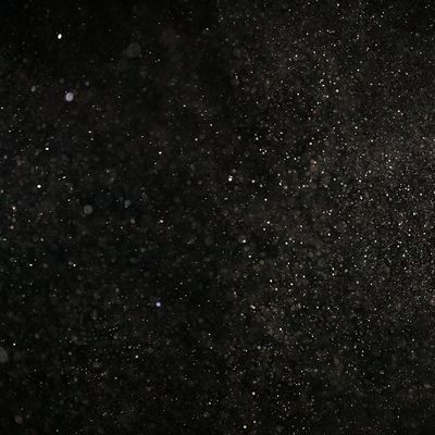 Sunlight filtering through a window, illuminating dust particles in the air.